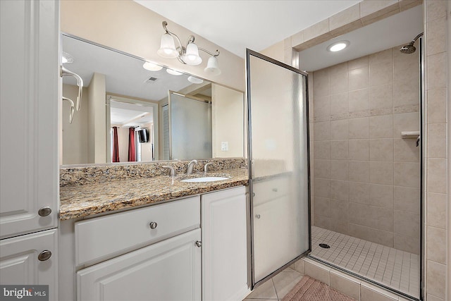 4201 Coastal Hwy Unit 116, Ocean City, MD 21842 - bathroom featuring vanity, tile patterned floors, a stall shower, and visible vents