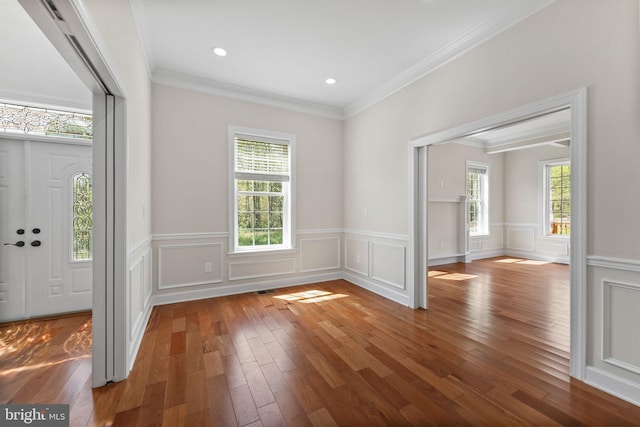 12304 Popes Head Rd, Fairfax, VA 22030 - foyer entrance with wainscoting, hardwood / wood-style flooring, and crown molding