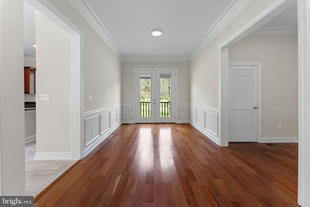 12304 Popes Head Rd, Fairfax, VA 22030 - interior space featuring a wainscoted wall, wood finished floors, french doors, a decorative wall, and crown molding