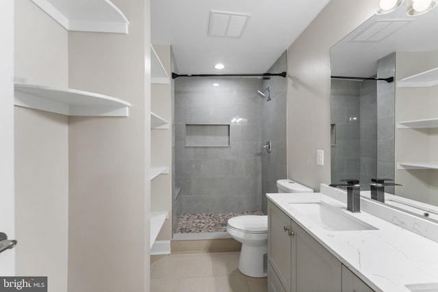 12304 Popes Head Rd, Fairfax, VA 22030 - full bathroom with tile patterned floors, vanity, a tile shower, toilet, and visible vents