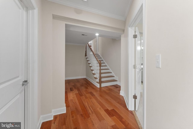 12304 Popes Head Rd, Fairfax, VA 22030 - hallway with baseboards, light wood finished floors, stairs, and ornamental molding