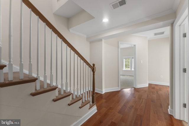 12304 Popes Head Rd, Fairfax, VA 22030 - foyer entrance featuring wood finished floors, visible vents, crown molding, and stairway