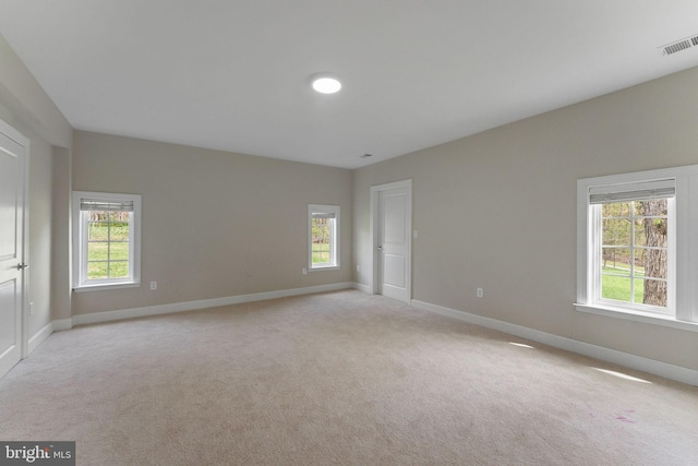 12304 Popes Head Rd, Fairfax, VA 22030 - spare room featuring light carpet, a healthy amount of sunlight, and visible vents