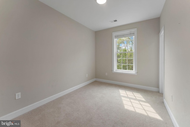 12304 Popes Head Rd, Fairfax, VA 22030 - empty room with baseboards, visible vents, and light colored carpet