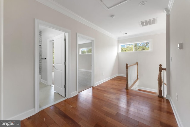 12304 Popes Head Rd, Fairfax, VA 22030 - hall with crown molding, wood finished floors, an upstairs landing, and visible vents