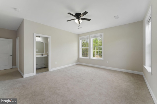 12304 Popes Head Rd, Fairfax, VA 22030 - unfurnished bedroom with ensuite bath, baseboards, and light colored carpet