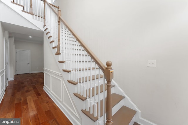 12304 Popes Head Rd, Fairfax, VA 22030 - stairs with wood finished floors and a decorative wall