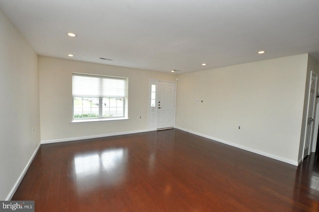unfurnished living room with recessed lighting, baseboards, visible vents, and wood finished floors