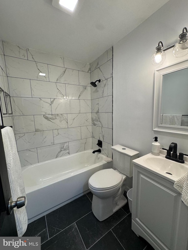 bathroom featuring toilet, shower / washtub combination, marble finish floors, and vanity