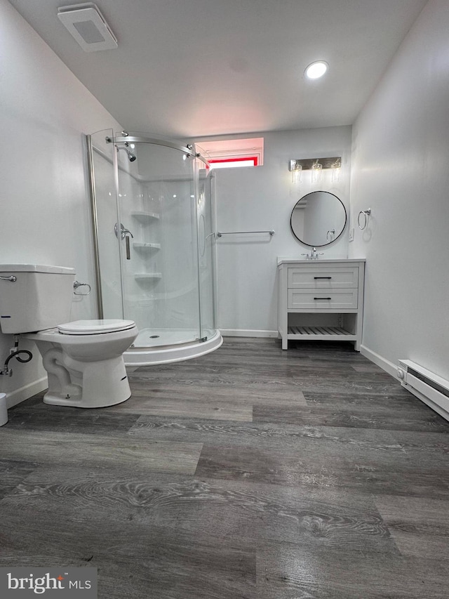 bathroom with toilet, wood finished floors, a shower stall, baseboards, and recessed lighting