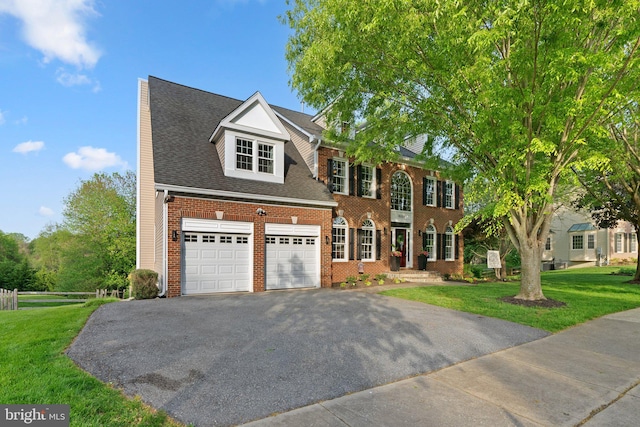 19009 Old Baltimore Rd, Brookeville, MD 20833 - colonial house featuring brick siding, an attached garage, driveway, and a front lawn