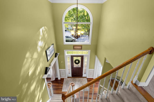 19009 Old Baltimore Rd, Brookeville, MD 20833 - entryway featuring crown molding, wood finished floors, a notable chandelier, and stairway