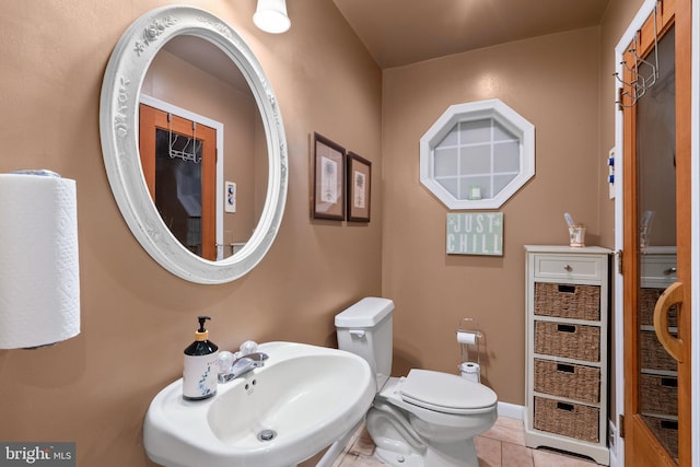19009 Old Baltimore Rd, Brookeville, MD 20833 - half bathroom featuring a sink, tile patterned flooring, and toilet