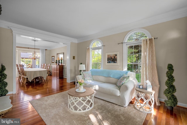 19009 Old Baltimore Rd, Brookeville, MD 20833 - living room featuring crown molding, baseboards, hardwood / wood-style flooring, and a chandelier