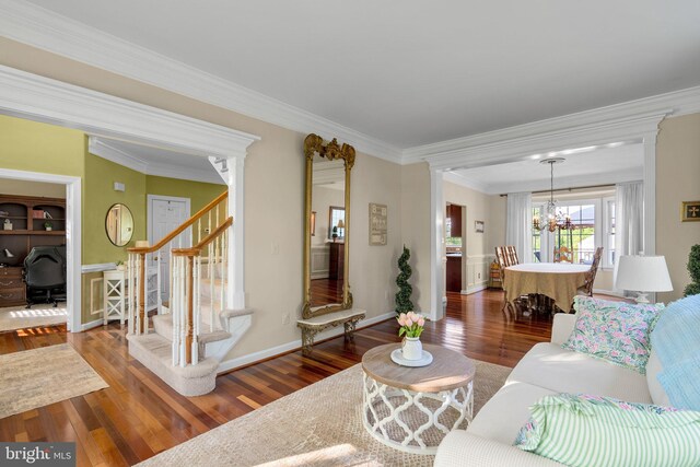 19009 Old Baltimore Rd, Brookeville, MD 20833 - living room with an inviting chandelier, wood-type flooring, stairs, baseboards, and ornamental molding