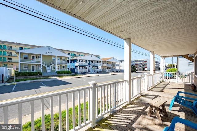 12506 Assawoman Dr, Ocean City, MD 21842 - balcony featuring covered porch and a residential view