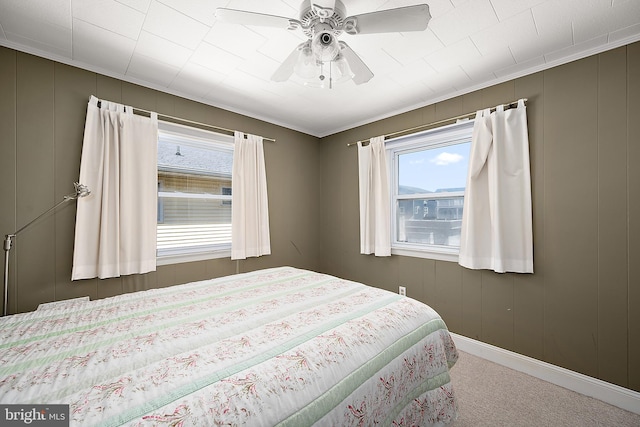 12506 Assawoman Dr, Ocean City, MD 21842 - bedroom featuring carpet, a decorative wall, baseboards, and ceiling fan