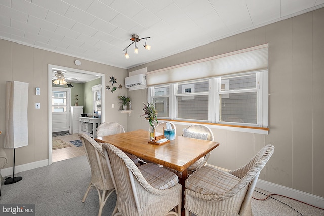 12506 Assawoman Dr, Ocean City, MD 21842 - dining room featuring an AC wall unit, baseboards, a ceiling fan, and light colored carpet