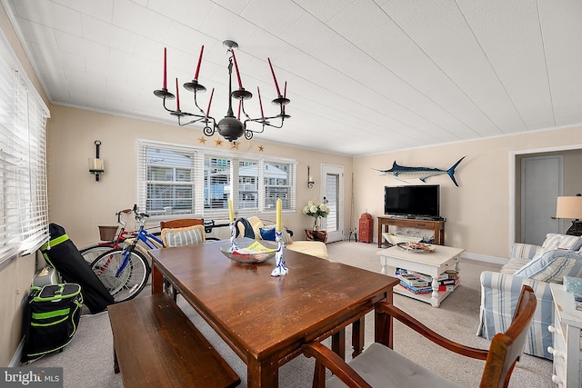 12506 Assawoman Dr, Ocean City, MD 21842 - dining space with baseboards, an inviting chandelier, and carpet