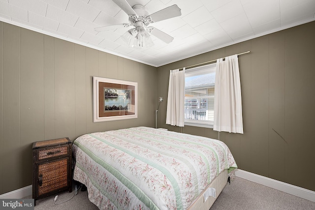 12506 Assawoman Dr, Ocean City, MD 21842 - carpeted bedroom with a decorative wall, a ceiling fan, and baseboards
