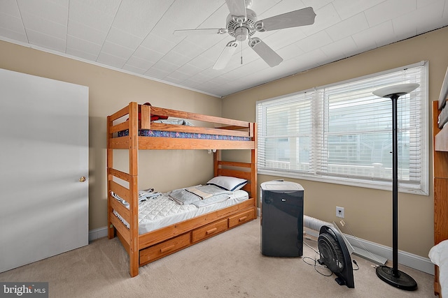 12506 Assawoman Dr, Ocean City, MD 21842 - carpeted bedroom featuring ceiling fan, baseboards, and ornamental molding