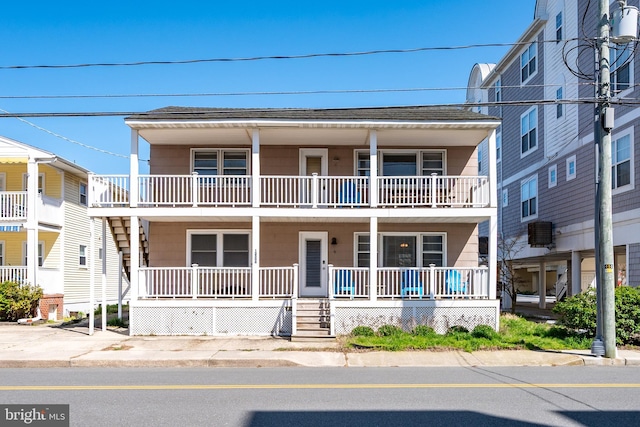 12506 Assawoman Dr, Ocean City, MD 21842 - multi unit property featuring roof with shingles and covered porch