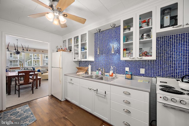 12506 Assawoman Dr, Ocean City, MD 21842 - kitchen featuring dark wood finished floors, a ceiling fan, ornamental molding, a sink, and white appliances