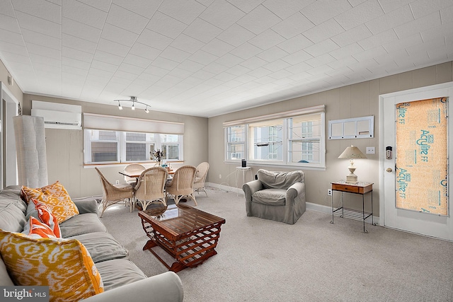 12506 Assawoman Dr, Ocean City, MD 21842 - carpeted living area featuring a wall mounted air conditioner and baseboards