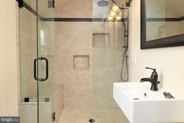 full bathroom with a sink and a stall shower