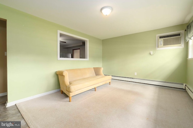 unfurnished room with a baseboard heating unit, baseboards, and a wall mounted AC