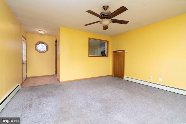 unfurnished room with a baseboard heating unit, carpet floors, a ceiling fan, and baseboards