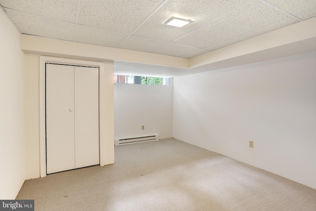 6218 30th St NW, Washington, DC 20015 - unfurnished bedroom with a baseboard radiator, carpet floors, a drop ceiling, and a closet