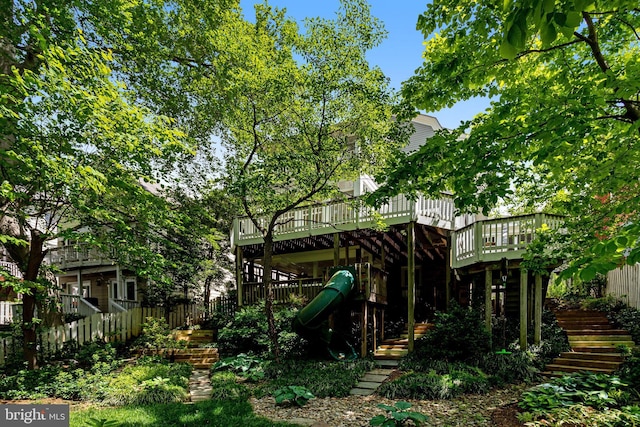 6218 30th St NW, Washington, DC 20015 - view of playground with stairs, a wooden deck, and fence