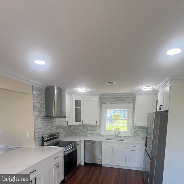 151 Pageant Ln, Willingboro, NJ 08046 - kitchen featuring appliances with stainless steel finishes, wall chimney exhaust hood, a sink, backsplash, and light countertops