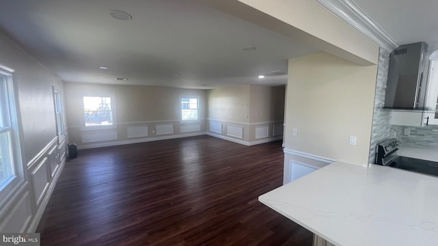 151 Pageant Ln, Willingboro, NJ 08046 - unfurnished living room featuring dark wood-style floors, a decorative wall, wainscoting, and recessed lighting
