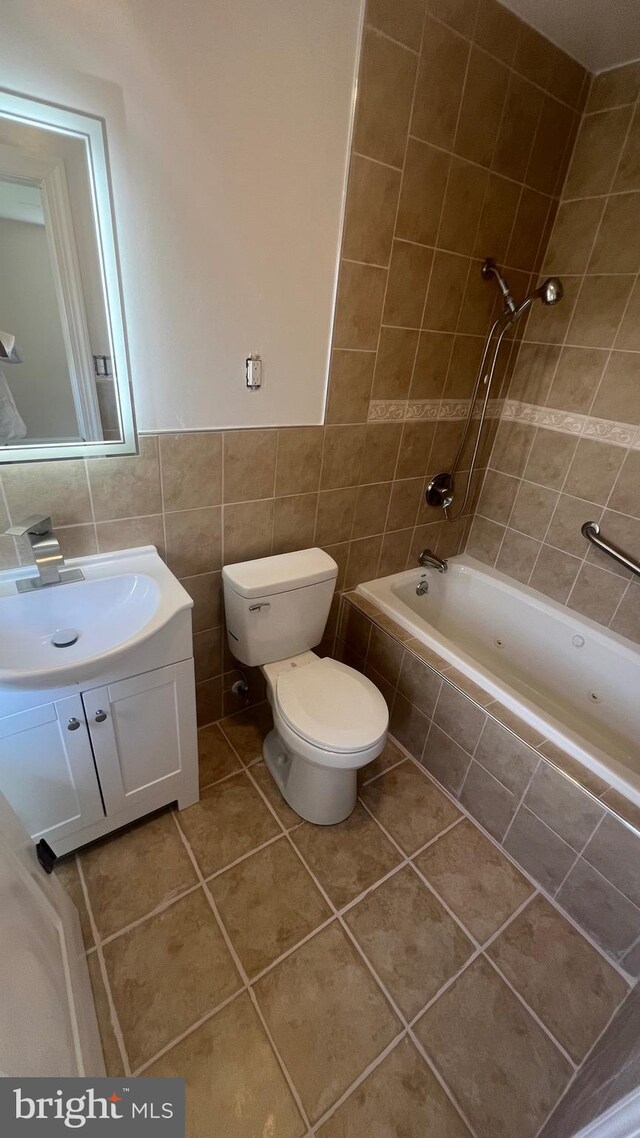 151 Pageant Ln, Willingboro, NJ 08046 - full bathroom featuring tile walls, tile patterned floors, tiled shower / bath, toilet, and vanity