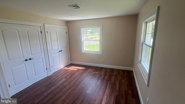 151 Pageant Ln, Willingboro, NJ 08046 - unfurnished bedroom featuring dark wood-style flooring and baseboards