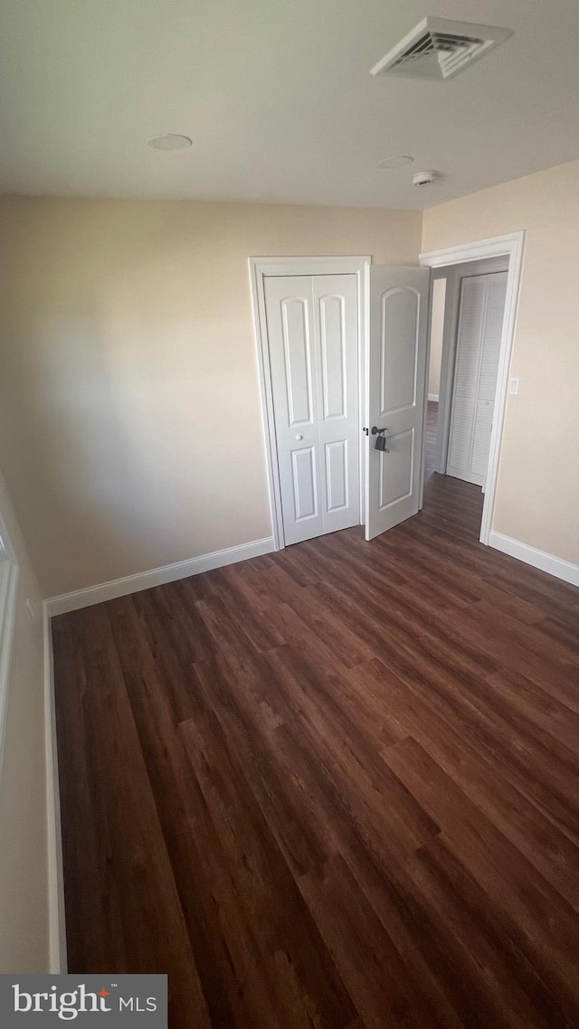 151 Pageant Ln, Willingboro, NJ 08046 - unfurnished room featuring baseboards and dark wood-type flooring