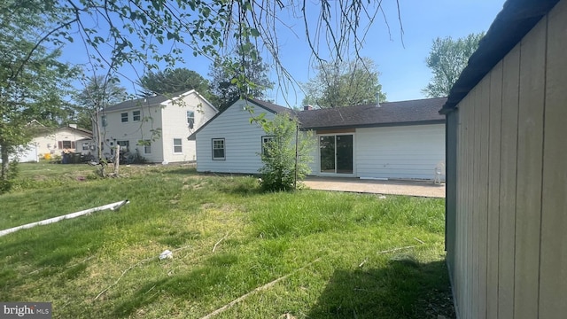 151 Pageant Ln, Willingboro, NJ 08046 - back of house with a patio area, a lawn, and roof with shingles