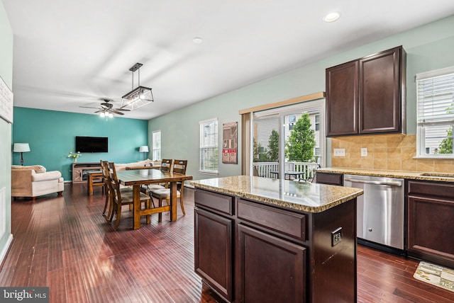 kitchen with dark wood finished floors, dark brown cabinets, ceiling fan, dishwasher, and open floor plan