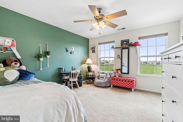 bedroom with a ceiling fan, visible vents, carpet, and baseboards
