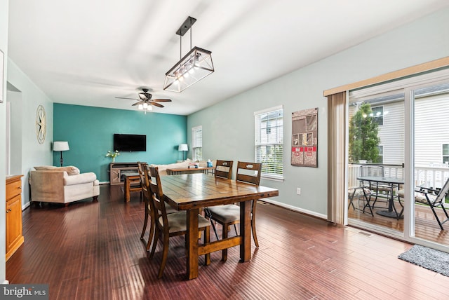 dining room featuring ceiling fan, baseboards, dark wood-style flooring, and visible vents