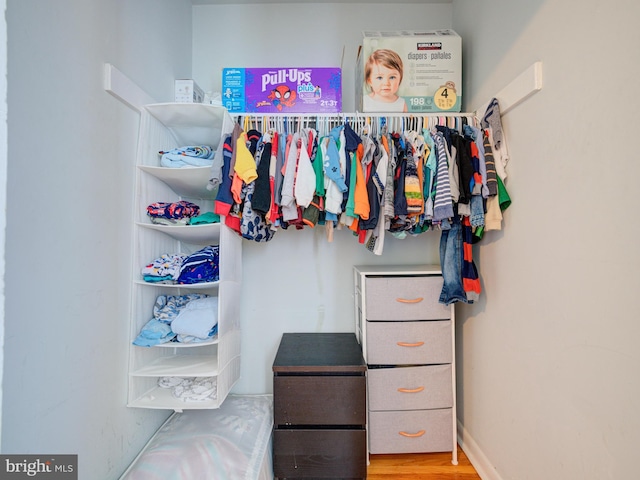 spacious closet featuring wood finished floors