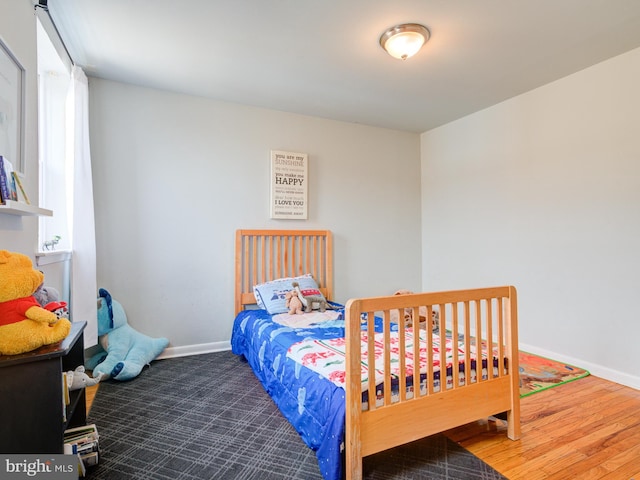 bedroom featuring baseboards