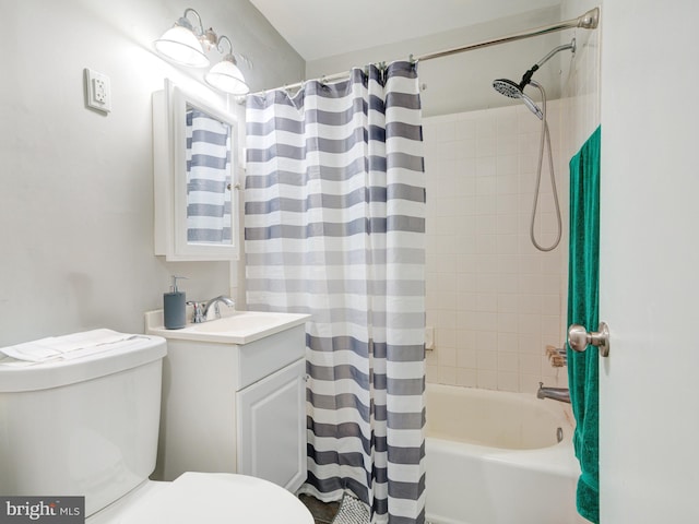 bathroom featuring shower / bath combo, vanity, and toilet