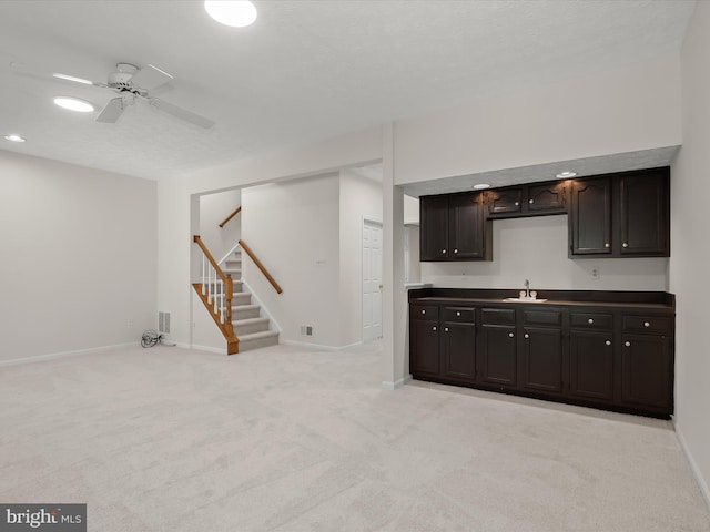2828 Quarry Heights Way, Baltimore, MD 21209 - kitchen with a sink, light carpet, baseboards, a ceiling fan, and dark brown cabinetry