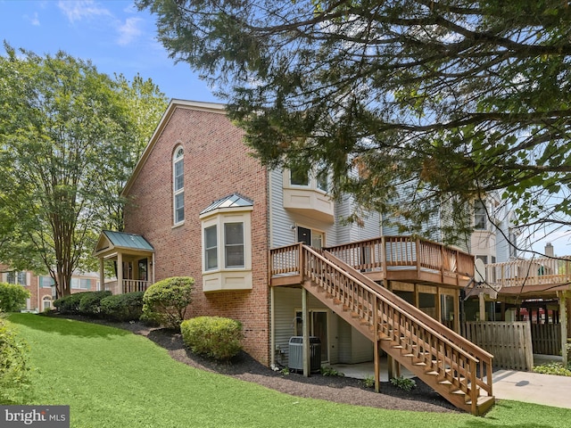 2828 Quarry Heights Way, Baltimore, MD 21209 - rear view of property with stairway, brick siding, a wooden deck, and cooling unit