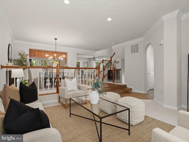 2828 Quarry Heights Way, Baltimore, MD 21209 - living area featuring a chandelier, stairs, arched walkways, plenty of natural light, and ornamental molding