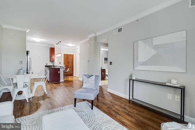 6301 Edsall Rd Unit 303, Alexandria, VA 22312 - living area featuring visible vents, baseboards, ornamental molding, and dark wood finished floors
