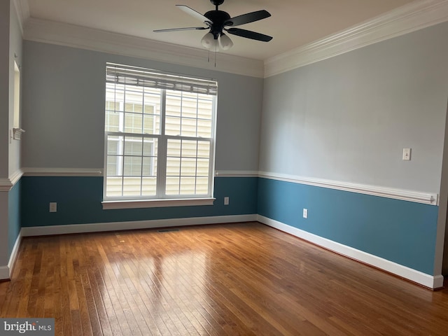 16258 John Rowland Trl, Milton, DE 19968 - spare room featuring healthy amount of natural light, hardwood / wood-style flooring, ceiling fan, and ornamental molding